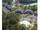 Scenic aerial view of a condo community with a swimming pool next to the golf course at 524 Pinehurst Ln. # 19D, Pawleys Island, SC 29585