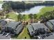 Aerial view of condominium buildings next to a golf course and pond at 524 Pinehurst Ln. # 19D, Pawleys Island, SC 29585