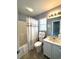This bathroom has a tub/shower combo and a single sink vanity with a mirror and a window at 524 Pinehurst Ln. # 19D, Pawleys Island, SC 29585