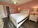 Inviting bedroom with a queen bed, bedside tables, and modern decor at 524 Pinehurst Ln. # 19D, Pawleys Island, SC 29585