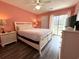 Comfortable bedroom featuring a queen bed and dresser, with backyard views at 524 Pinehurst Ln. # 19D, Pawleys Island, SC 29585