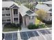 Beautiful condo building with two-story access stairs, lush landscaping, and ample parking at 524 Pinehurst Ln. # 19D, Pawleys Island, SC 29585