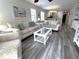 Comfortable living room with sofas, coffee table, and natural light at 524 Pinehurst Ln. # 19D, Pawleys Island, SC 29585