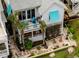 Beautiful aerial view of a home featuring a patio, balconies, and lush landscaping at 5361 Ocean Village Dr., Myrtle Beach, SC 29577