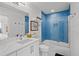 Updated bathroom featuring sleek vanity, tub with blue tile, and contemporary fixtures for a spa-like feel at 5361 Ocean Village Dr., Myrtle Beach, SC 29577