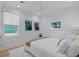 Bright bedroom features recessed lighting, ceiling fan, charming wall art, and a plush white rug at 5361 Ocean Village Dr., Myrtle Beach, SC 29577