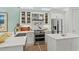 Modern kitchen with stainless steel appliances, white cabinets, and quartz countertops at 5361 Ocean Village Dr., Myrtle Beach, SC 29577