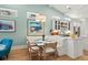 Eat-in kitchen with banquette seating, modern lighting, stainless appliances and bright countertops at 5361 Ocean Village Dr., Myrtle Beach, SC 29577