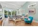Comfortable living room featuring a sectional sofa, vaulted ceiling, and scenic outdoor views at 5361 Ocean Village Dr., Myrtle Beach, SC 29577