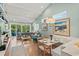 Bright and airy living room with vaulted ceilings, hardwood floors and access to the outdoors at 5361 Ocean Village Dr., Myrtle Beach, SC 29577