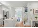 Bright, open-concept living room showcasing a modern kitchen, staircase, and elegant decor at 5361 Ocean Village Dr., Myrtle Beach, SC 29577