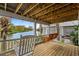 Inviting porch with a swing, rocking chair, and scenic waterfront views at 5361 Ocean Village Dr., Myrtle Beach, SC 29577