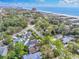 Beautiful aerial view of a lush neighborhood with ocean views and vibrant green trees along the coast at 5525 Springs Ave., Myrtle Beach, SC 29577