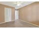 Bedroom featuring a carpet floor, neutral color scheme, and a door leading to an adjacent bathroom at 5525 Springs Ave., Myrtle Beach, SC 29577
