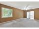 Bedroom with a ceiling fan, large window and sliding glass door to the outside at 5525 Springs Ave., Myrtle Beach, SC 29577