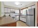 Well-equipped kitchen features white cabinets, modern appliances, and ample counter space at 5525 Springs Ave., Myrtle Beach, SC 29577
