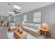 Living room with comfortable seating, bright natural light, a skylight, and ceiling fans at 5525 Springs Ave., Myrtle Beach, SC 29577