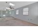 Spacious living area with a skylight, carpet floors, ceiling fans, and abundant natural light at 5525 Springs Ave., Myrtle Beach, SC 29577