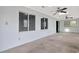 Living area with ample natural light, carpet floors, ceiling fans, and large windows at 5525 Springs Ave., Myrtle Beach, SC 29577