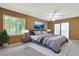 Serene main bedroom featuring soft lighting, a comfortable bed, and access to a private outdoor space at 5525 Springs Ave., Myrtle Beach, SC 29577