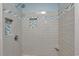 Tiled shower with built-in shower niches, chrome showerhead, and built in seat at 5525 Springs Ave., Myrtle Beach, SC 29577
