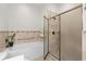Tiled bathroom featuring a separate tub and shower, providing a spa-like experience at 5628 Marion Circle, Myrtle Beach, SC 29577