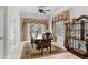 Charming dining room featuring elegant curtains, a wooden table, and plenty of natural light at 5628 Marion Circle, Myrtle Beach, SC 29577