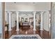 Grand foyer with elegant columns, hardwood floors, and a view into the spacious living area at 5628 Marion Circle, Myrtle Beach, SC 29577
