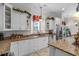 Modern kitchen with stainless steel appliances, granite countertops, and white cabinetry at 5628 Marion Circle, Myrtle Beach, SC 29577