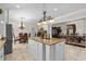 Open kitchen with a large island, stainless steel appliances, and a breakfast nook at 5628 Marion Circle, Myrtle Beach, SC 29577