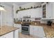 Well-equipped kitchen featuring granite countertops, stainless steel appliances, and custom cabinetry at 5628 Marion Circle, Myrtle Beach, SC 29577
