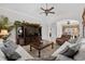 Inviting living room with large sectional, entertainment center, and seamless flow to the dining area at 5628 Marion Circle, Myrtle Beach, SC 29577