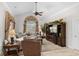 Bright living room with vaulted ceilings, large window with decorative curtains, and comfortable seating at 5628 Marion Circle, Myrtle Beach, SC 29577