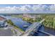 Stunning aerial view of waterway, bridge, waterway, marina, and resort with beautiful green landscape at 5751 Oyster Catcher Dr. # 234, North Myrtle Beach, SC 29582