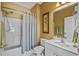 Clean bathroom showcasing a shower-tub combo, vanity with a sink, and neutral decor at 5751 Oyster Catcher Dr. # 234, North Myrtle Beach, SC 29582