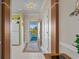Bright entryway with a view to the outside and an adjacent kitchen, creating an inviting welcome at 5751 Oyster Catcher Dr. # 234, North Myrtle Beach, SC 29582
