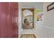 Inviting home entryway with tile floors, arched doorways, and views into the bright living room with vaulted ceiling at 5751 Oyster Catcher Dr. # 234, North Myrtle Beach, SC 29582