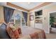 Comfortable main bedroom featuring a window with curtains and a built-in display and storage niche at 5751 Oyster Catcher Dr. # 234, North Myrtle Beach, SC 29582