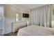 Comfortable bedroom with dresser, mirror, TV, modern wood flooring, and cozy bed at 5905 S Kings Hwy. # A551, Myrtle Beach, SC 29575