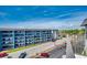 Exterior view of condo building featuring balconies overlooking a parking lot with scenic views, adding outdoor living space at 5905 S Kings Hwy. # A551, Myrtle Beach, SC 29575