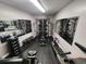 Well-equipped home gym featuring modern exercise equipment, mirrors, and a clean design, promoting a healthy lifestyle at 5905 S Kings Hwy. # A551, Myrtle Beach, SC 29575
