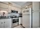 Bright kitchen featuring white cabinetry, stainless steel appliances, and durable countertops at 5905 S Kings Hwy. # A551, Myrtle Beach, SC 29575