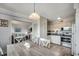 Open-concept kitchen and dining area with modern table, stainless appliances, and bright light at 5905 S Kings Hwy. # A551, Myrtle Beach, SC 29575