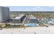 Aerial view of a beachside resort with pools, condo buildings, parking, and direct access to the beach at 5905 South Kings Hwy. # 132-A, Myrtle Beach, SC 29575