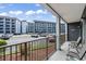 Balcony with seating and views of the parking lot and condo buildings, offering a glimpse of the community at 5905 South Kings Hwy. # 132-A, Myrtle Beach, SC 29575
