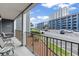 Balcony with seating and views of the parking lot and condo buildings, showcasing the community setting at 5905 South Kings Hwy. # 132-A, Myrtle Beach, SC 29575