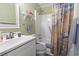 Bathroom with white vanity, commode and tub/shower featuring a decorative curtain at 5905 South Kings Hwy. # 132-A, Myrtle Beach, SC 29575