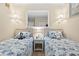 Cozy bedroom with two twin beds, nautical decor, and a shared nightstand at 5905 South Kings Hwy. # 132-A, Myrtle Beach, SC 29575