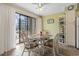Bright dining area with seating for six and a view of the balcony at 5905 South Kings Hwy. # 132-A, Myrtle Beach, SC 29575