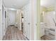 Inviting hallway leading to a bathroom and bedroom, showcasing the layout of the condo at 5905 South Kings Hwy. # 132-A, Myrtle Beach, SC 29575